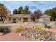 Charming home featuring desert landscaping with rock features and a well-maintained front yard at 3580 Unicorn Ave, Pahrump, NV 89048