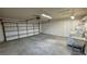 Spacious garage with washer, dryer, utility sink, and automatic garage door at 3580 Unicorn Ave, Pahrump, NV 89048