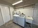 Functional laundry area with modern washer, dryer, and utility sink at 3580 Unicorn Ave, Pahrump, NV 89048