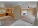 Open floor plan featuring a kitchen and living room with a brick fireplace at 3580 Unicorn Ave, Pahrump, NV 89048