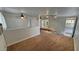 Comfortable living area with neutral walls, carpeting and half-wall separation at 3580 Unicorn Ave, Pahrump, NV 89048