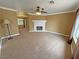 Large living room with a fireplace and ceiling fan at 3580 Unicorn Ave, Pahrump, NV 89048