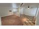 Spacious living area featuring ceiling fan, neutral walls, and mixed flooring styles at 3580 Unicorn Ave, Pahrump, NV 89048