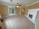 Spacious living room with neutral carpet and a fireplace at 3580 Unicorn Ave, Pahrump, NV 89048