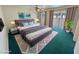 Spacious bedroom featuring a king bed, ceiling fan, and sliding glass door at 3580 Unicorn Ave, Pahrump, NV 89048