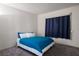 Bedroom with blue comforter at 3934 Sir Payne Ct, Las Vegas, NV 89104