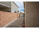 Side yard view showing a walkway leading to a secure gate at 3934 Sir Payne Ct, Las Vegas, NV 89104