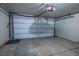 Spacious garage with a large door and automatic opener for secure parking and storage at 3934 Sir Payne Ct, Las Vegas, NV 89104