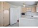 Kitchen with updated white appliances, ample cabinet storage and adjacent dining area at 3934 Sir Payne Ct, Las Vegas, NV 89104