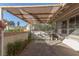 Back patio featuring a stone paver floor, covered awning, and small seating area at 5010 Mick Pl, Las Vegas, NV 89103
