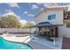 Backyard with a pool, patio, fire pit, covered dining area, and desert landscaping at 5010 Mick Pl, Las Vegas, NV 89103