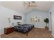 Serene bedroom featuring a ceiling fan, plantation shutters, and stylish decor at 5010 Mick Pl, Las Vegas, NV 89103