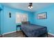 Bright bedroom with a comfortable bed, window shutters, modern decor, and wood-look flooring at 5010 Mick Pl, Las Vegas, NV 89103
