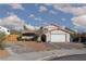 Charming single-Gathering home with a two-car garage, mature trees, and a well-maintained front yard at 5010 Mick Pl, Las Vegas, NV 89103