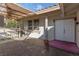 Welcoming front porch featuring a tiled patio, double doors, and an awning with seating at 5010 Mick Pl, Las Vegas, NV 89103