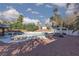 Lush backyard with pool, palm trees, and shaded lounge areas for outdoor enjoyment at 5010 Mick Pl, Las Vegas, NV 89103