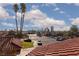 Neighborhood view featuring the Las Vegas skyline with a tiled roof in the foreground at 5010 Mick Pl, Las Vegas, NV 89103