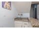 Convenient wet bar area with a granite countertop and a small sink, perfect for entertaining guests at 5010 Mick Pl, Las Vegas, NV 89103