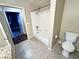 Bathroom featuring a shower-tub combo, toilet, and granite countertop vanity with storage at 5250 S Rainbow Blvd # 1131, Las Vegas, NV 89118