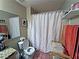 Well-organized bathroom featuring a shower with curtain and shelving for towels and toiletries at 5250 S Rainbow Blvd # 1131, Las Vegas, NV 89118