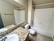 Bathroom featuring granite countertop, single sink, tile flooring, and bathtub with tile surround at 5250 S Rainbow Blvd # 1131, Las Vegas, NV 89118