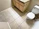 Bathroom featuring tile flooring, wood cabinets, and toilet at 5250 S Rainbow Blvd # 1131, Las Vegas, NV 89118