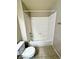 Bathroom featuring white tile shower-tub surround and toilet at 5250 S Rainbow Blvd # 1131, Las Vegas, NV 89118
