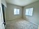 Bedroom featuring neutral color walls, carpet, and two windows with blinds at 5250 S Rainbow Blvd # 1131, Las Vegas, NV 89118