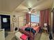 A spacious bedroom featuring a canopy bed, a ceiling fan, and lots of natural light at 5250 S Rainbow Blvd # 1131, Las Vegas, NV 89118
