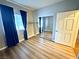 Cozy bedroom featuring mirrored closet doors, laminate wood floors, and natural light from the window at 5250 S Rainbow Blvd # 1131, Las Vegas, NV 89118