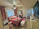 A spacious bedroom featuring a canopy bed, a ceiling fan, and lots of natural light at 5250 S Rainbow Blvd # 1131, Las Vegas, NV 89118