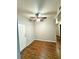 A clean bedroom showing neutral walls, wood floors, and a ceiling fan, creating a calm, modern space at 5250 S Rainbow Blvd # 1131, Las Vegas, NV 89118