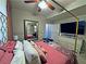 Comfortable bedroom featuring plush bedding, a ceiling fan, and a TV, creating a relaxing retreat at 5250 S Rainbow Blvd # 1131, Las Vegas, NV 89118