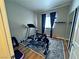 Functional bedroom turned into a home gym, complete with exercise equipment and natural light at 5250 S Rainbow Blvd # 1131, Las Vegas, NV 89118