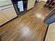 Kitchen with wood-look flooring complemented by stainless steel appliances and light wood cabinets at 5250 S Rainbow Blvd # 1131, Las Vegas, NV 89118