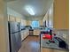 Spacious kitchen with stainless steel appliances, wood cabinets, and ample counter space at 5250 S Rainbow Blvd # 1131, Las Vegas, NV 89118