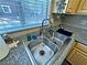 Kitchen featuring a stainless steel sink and granite countertops with a window view at 5250 S Rainbow Blvd # 1131, Las Vegas, NV 89118