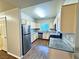 Kitchen featuring stainless steel appliances, granite countertops, and wood cabinets at 5250 S Rainbow Blvd # 1131, Las Vegas, NV 89118