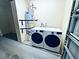 Laundry area featuring a washing machine, dryer, and water heater at 5250 S Rainbow Blvd # 1131, Las Vegas, NV 89118