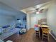 Open-concept living room featuring a ceiling fan, dining table, and comfortable sofa at 5250 S Rainbow Blvd # 1131, Las Vegas, NV 89118