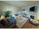 Comfortable living room with fireplace, ample seating, and lots of natural light at 5250 S Rainbow Blvd # 1131, Las Vegas, NV 89118