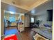 Open-concept living room with hardwood floors, connecting the kitchen to the living area at 5250 S Rainbow Blvd # 1131, Las Vegas, NV 89118