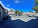 Exterior view of townhomes and a cul-de-sac showcasing the architecture and surrounding landscape at 5250 S Rainbow Blvd # 1131, Las Vegas, NV 89118