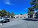 Exterior view of townhomes and a cul-de-sac showcasing the architecture and surrounding landscape at 5250 S Rainbow Blvd # 1131, Las Vegas, NV 89118