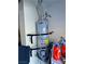 Close-up view of an AO Smith 100 water heater in a small utility space with red liquid detergents at 5250 S Rainbow Blvd # 1131, Las Vegas, NV 89118