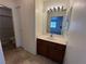 Bathroom with tile floors features a single sink vanity and shower-tub combo at 5253 Westwind Rd, Las Vegas, NV 89118