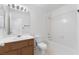 A tidy bathroom featuring a tub with shower, tile flooring and vanity with sink at 5253 Westwind Rd, Las Vegas, NV 89118