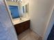 Bathroom features a single sink vanity with tile floors at 5253 Westwind Rd, Las Vegas, NV 89118