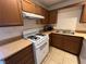 Cozy kitchen featuring modern gas range stove, updated counters, and ample cabinet space at 5253 Westwind Rd, Las Vegas, NV 89118