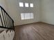 Bright living room featuring hardwood floors and large windows at 5253 Westwind Rd, Las Vegas, NV 89118